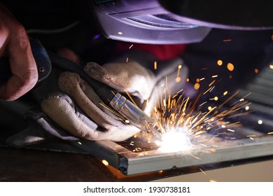 Male Hand Welding Steel Close Up