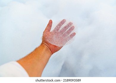 Male Hand With White Foam For Foam Party. Dancing To Music On A Dance Floor Covered With A Few Feet Of Foam Or Bubbles Emitted From The Foaming Agent. Background And Texture.