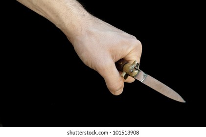 Male Hand With Wood Pocket Knife Isolated In Black