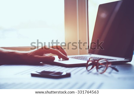 male hand working with laptop