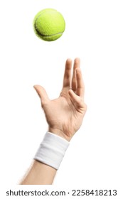 Male hand with a wristband throwing a tennis ball isolated on white background