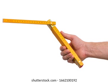 Male Hand with yellow wooden meter. Human Hand holding tool, Isolated on White Background.