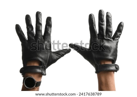 Male hands in black leather gloves isolated on white background, closeup