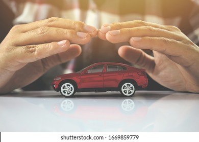 Male Hands And Car As Protection Of Car Concept