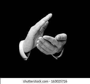 Male Hands Clapping Isolated Over Black Background