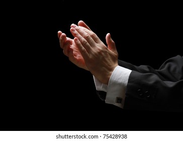 Male hands clapping on black, side-view - Powered by Shutterstock