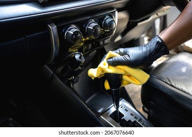 Male hands cleans car interior on carwash station - Shutterstock ID 2067076640