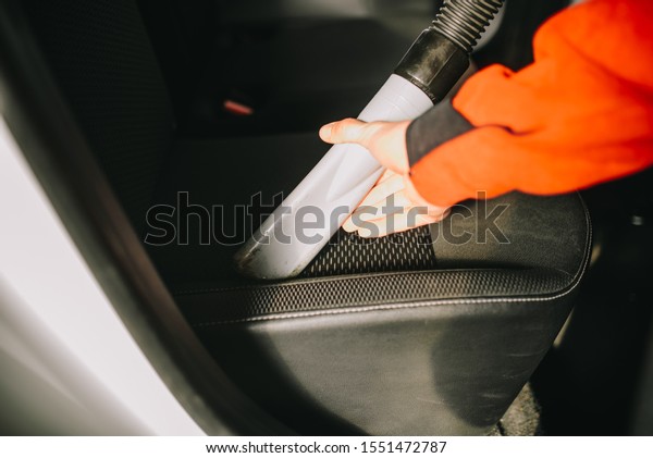 Male hands
cleans car interior on carwash
station