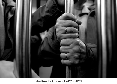 Male Hands Grabbing On Subway Pole