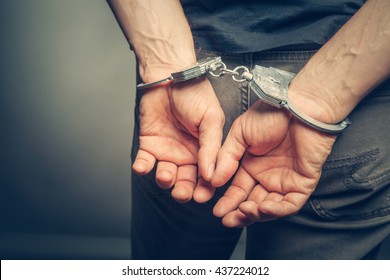 male hands in handcuffs - Shutterstock ID 437224012