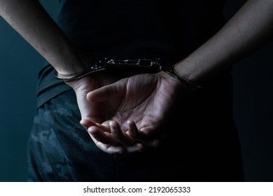 Male Hands In Handcuffs Black Background