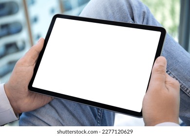 male hands holding computer tablet with isolated screen in the office 
 - Powered by Shutterstock