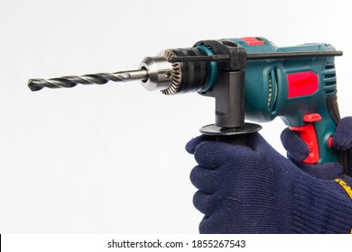 Male hands are holding an electric drill. Hands in blue gloves. Drill on a white background. - Powered by Shutterstock