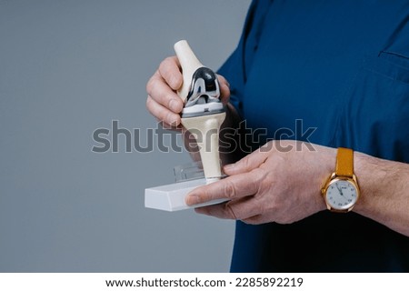 Male hands holding model maquette of knee joint patella Stock foto © 