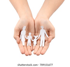 Male Hands Holding Paper Silhouette Of Family On White Background. Insurance Concept