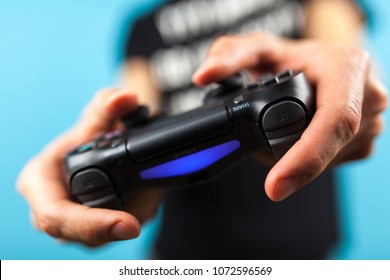 Male Hands Holding A PS4 Controller