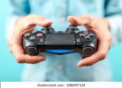 Male Hands Holding A PS4 Controller