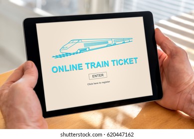 Male Hands Holding A Tablet With Online Train Ticket Concept