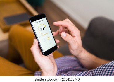 Male Hands Looking At The Weather App On His Smartphone. Adult Man Checking If It's Going To Rain 