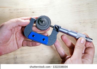 male hands with micrometer