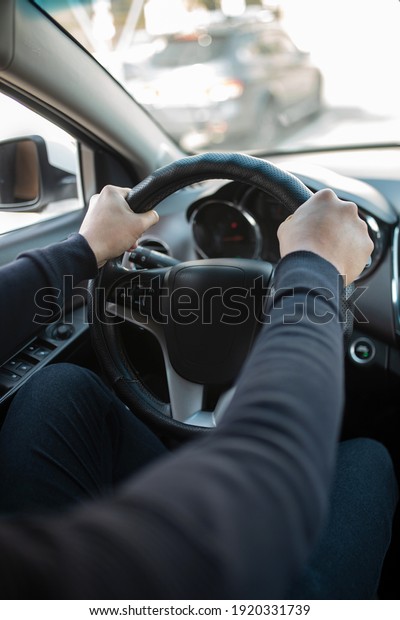 male hands on the steering\
wheel