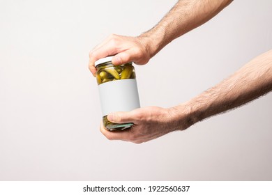 Male Hands Opening A Pickled Cucumber Jar Lid, Editable Mock-up Series Template Ready For Your Design, Label Selection Path Included.