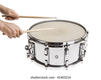 Male hands playing big metal snare drum isolated on white with sticks