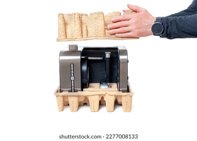 Male hands removing the cardboard insert from an espresso coffee machine during the unboxing process. Excitement and anticipation of unboxing a new home appliance. - Shutterstock ID 2277008133