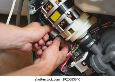 Male Hands Repair Broken  Dishwasher