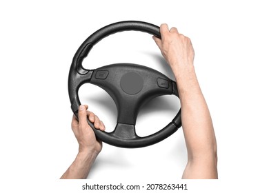 Male hands and steering wheel on white background