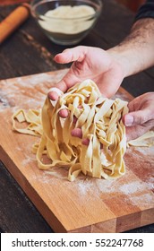 Male Hands Taking Handmade Pasta