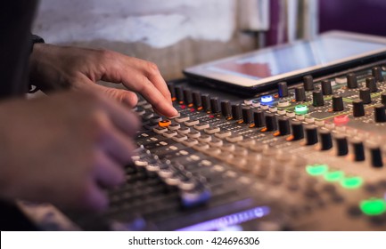 Male Hands Using A Sound Digital Mixer At A Concert