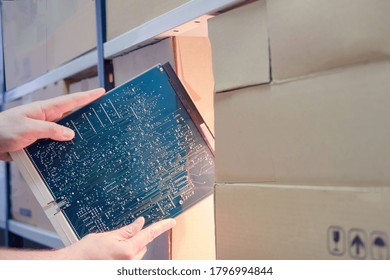 Male Hands In A Warehouse With Computer Chip, Night Theft