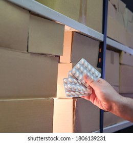 Male Hands In A Warehouse With Pill, Night Theft