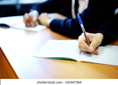 Male hands writing task while examination