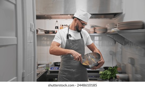 Male head chef prepare tasty fresh dish. Man cook meal restaurant kitchen. Young adult person work cafe cuisine white hat portrait. Guy make diet lunch food. Culinary worker job. Cookery staff uniform - Powered by Shutterstock