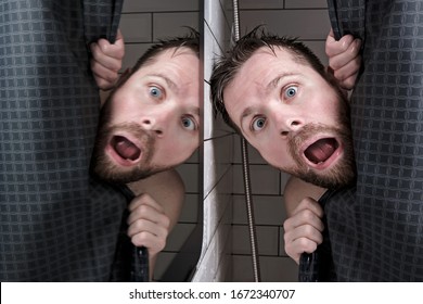 Male head is reflected in the mirror, peeking out from behind the curtains, in the shower with a grimace of horror on his face.