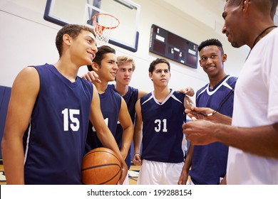 Male High School Basketball Team Having Team Talk With Coach - Powered by Shutterstock