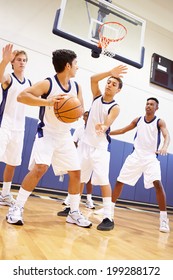 Male High School Basketball Team Playing Game