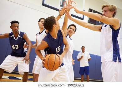 Male High School Basketball Team Playing Game