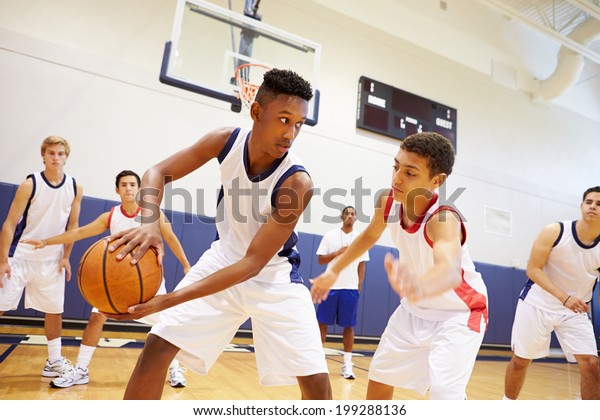 Male High School\
Basketball Team Playing\
Game