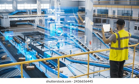 Male in a High Visibility Vest Using Tablet with Augmented Reality App. Worker Monitoring Efficiency in a Logistics Center with Automated Belt Conveyors for Sorting Retail Orders. VFX Visualization - Powered by Shutterstock