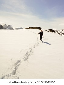 Male Hiker Going Through Deep Snow On The 