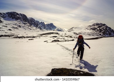 Male Hiker Going Through Deep Snow On The 