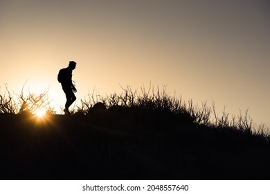 Male Hiker Silhouette Hiking Cross Country. 