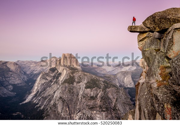 Male Hiker Standing On Overhanging Rock Stock Photo (Edit Now) 520250083