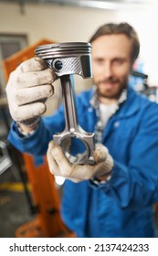 Male Holding Car Part In His Hands