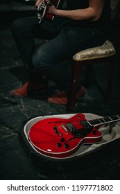 Male Holding Guitar, Guitar In Case