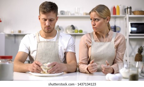 Male Holding Raw Dough, Wife Looking Awkwardly On Husband, Bad Cook, Problem