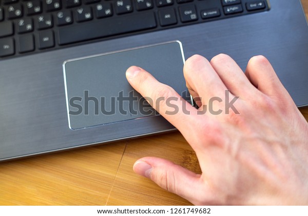 Male Index Finger On Laptop Trackpad Stock Photo (Edit Now) 1261749682